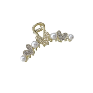 Elegante pinza para el cabello de metal dorado con perlas y corazones de strass