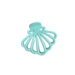 Mint green shell shaped hollow claw clip for women with matte finish on white background