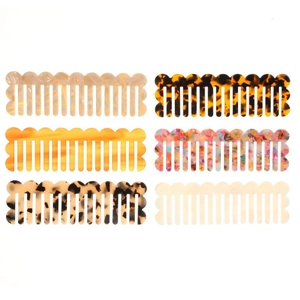 Set of six vintage acetate hair combs in various marble and tortoiseshell patterns