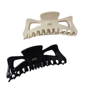 Set di due grandi mollette per capelli in acetato lucido crema e nero con scritta La France