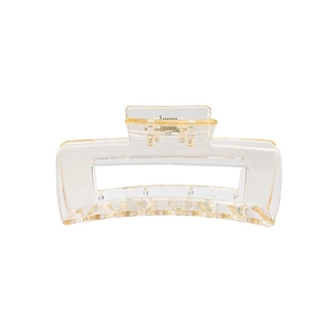 Close-up of rectangular hair claw clip with transparent acrylic and amber accents