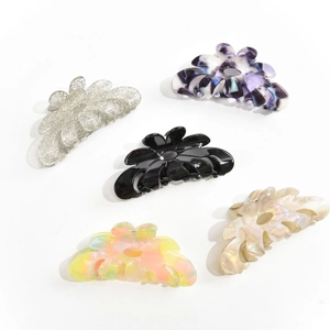 Five-piece acetate floral hair claw clips set in assorted colors on white background