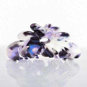 Macro shot of purple marble-patterned acetate flower claw clip showing elegant details