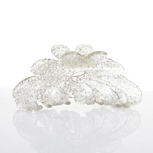 Detail of flower hair claw clip with silver glitter texture and metal spring mechanism