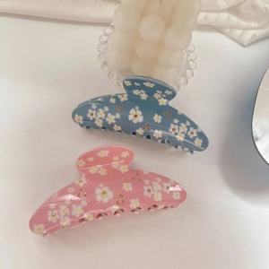 Haarklammern mit Gänseblümchen-Muster in Pastellrosa und Blau mit funkelnden Steinen