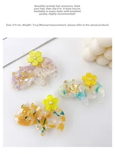 Detailed macro view of 6cm marble texture acetate cat hair clips in three colors