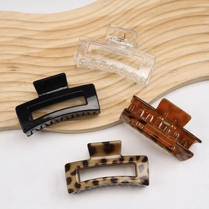 Four large square PC hair claws in clear, black, tortoise shell and leopard prints