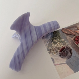 Detail view of purple marble acetate hair claw clip with vintage stone texture finish