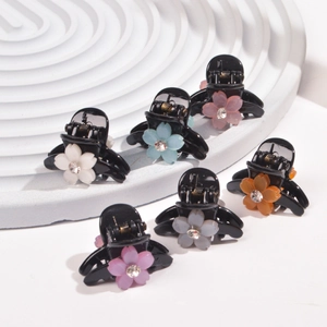 Detailed set of six small floral hair claws with colorful petals and crystal centers