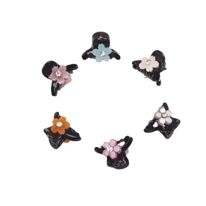 Set of 6 colorful floral hair claws with rhinestones on a clean white background