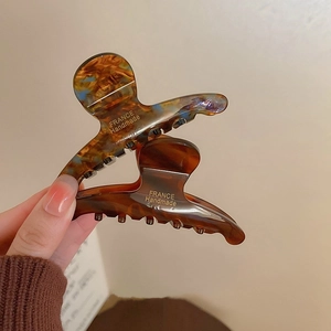 Handmade acetate geometric hair claw clips with amber and colorful marbled textures