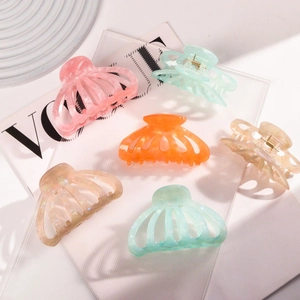 Chic acetate pumpkin hair claws in marble patterns and pastel colors for women