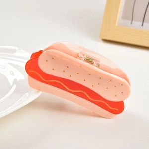 Close-up detail of hot dog shaped acetate hair claw clip with glossy resin finish