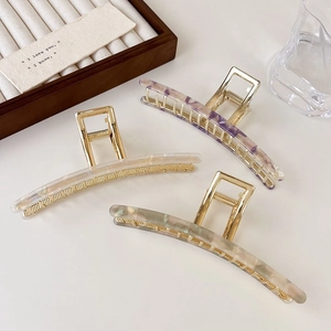 Three large gold metal shark hair clips with marble acetate texture for thick hair