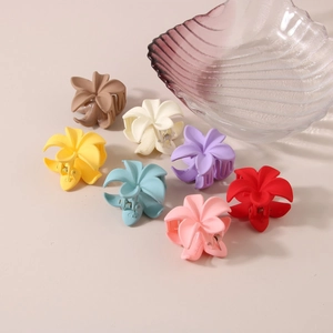 Set of 7 colorful plumeria flower hair claws with matte finish for summer styling