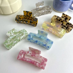 Large acetate hair claw clips in various leopard and marble patterns for thick hair