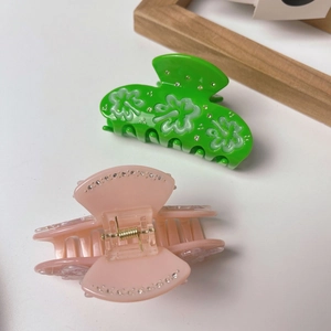 Elegant floral acetate hair claws with rhinestones in green and pink colors