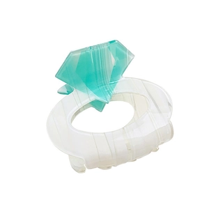 Elegant diamond ring shaped hair claw clip in translucent white with green gemstone decoration