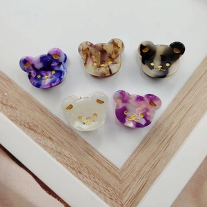 Five-piece set of cute acetate bear hair clips in diverse marble and amber textures