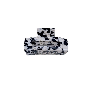 Minimalist black and white marble cow print acetate hair claw clip on white background