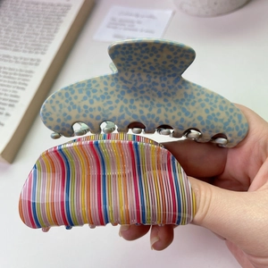 Chic acetate shark hair clips set featuring blue spotted and rainbow striped designs