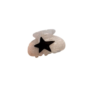 Translucent glitter hair claw clip with black star detail in a Korean fashion style