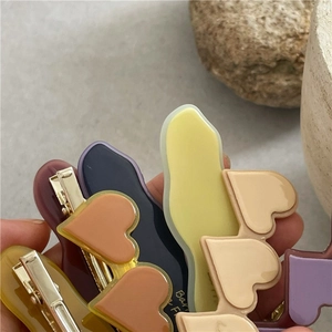 Assortimento di fermagli per capelli in acetato a forma di cuore e onde