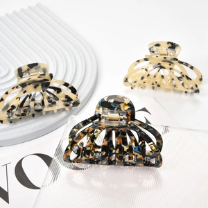 Close-up of leopard and tortoise shell acetate hair claws with premium metal springs