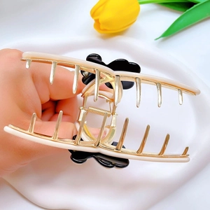 Chic cream and black acetate flower hair claw clip with golden metal teeth