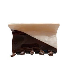 Minimalist bicolor acetate hair claw clip in beige and coffee brown with glossy finish