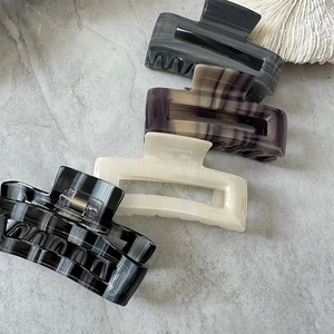 French style rectangle acetate hair claws in marble patterns and neutral colors