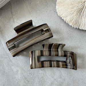 Vintage tortoiseshell acetate rectangle hair claw clips in coffee and cream stripe patterns
