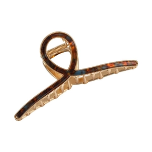 Elegant gold metal hair claw clip with brown tortoiseshell patterns and twisted trim