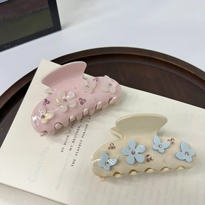 Elegant floral acetate hair claws with pink rhinestones in pink and cream beige