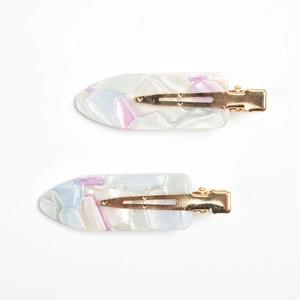 Detail of marble pattern acetate duckbill hair clips with gold metal crocodile clips