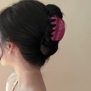 Elegant dragon fruit color acetate hair claw clip shown on model in minimalist setting