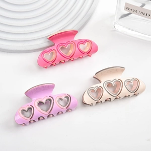 Lot de 3 pinces à cheveux en acétate avec cœurs évidés en rose, violet et blanc crème