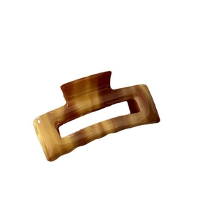 Rectangle acetate hair claw clip with brown marble pattern for women in minimalist style