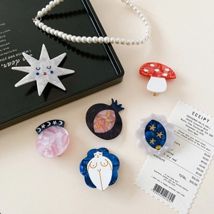 Artistic acetate hair clips set with mushroom and planet designs in oil painting style