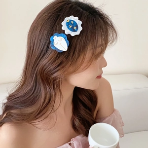 Elegant floral acetic acid hair clips featuring star and moon patterns on a female model