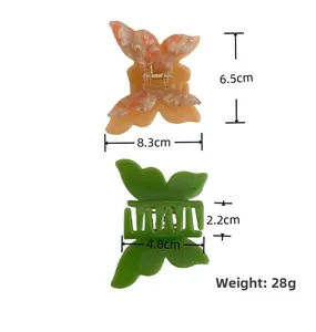 Detailed dimensions of double butterfly hair claws in marble pink and green