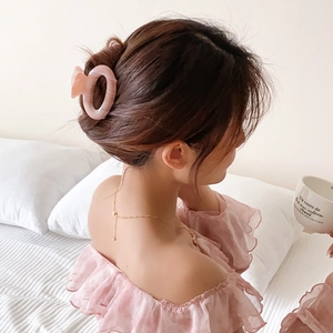 Pink marble texture acetate hair claw clip for women in elegant updo hairstyle