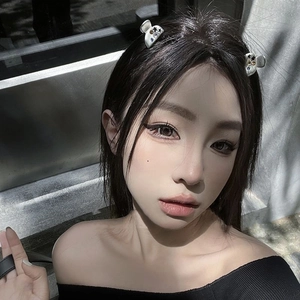 Close-up of mini star hair clips with colorful zircons on a model's hair side