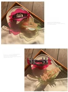Detail of wave-shaped hair claws in translucent fuchsia and lime gradient with leopard lining