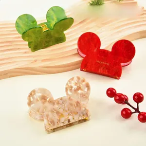 Three-piece set of festive acetate hair claws with marble texture and mouse ear design