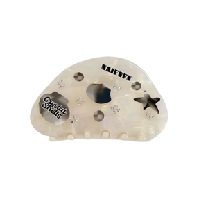 Dreamy shell-shaped acetate hair claw with colorful starfish pattern and crystals