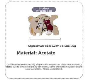 Vue détaillée d'une pince à cheveux ours en acétate avec dimensions de 9,2 cm par 6,5 cm