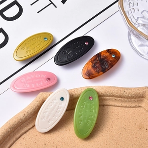 Barrettes à cheveux ovales en acétate avec cristaux et lettres gravées en six coloris