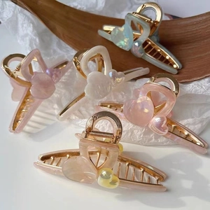 Elegant heart-shaped acetate hair claw clips in various pearlescent colors for women