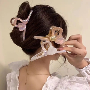Elegant iridescent acetate heart hair claw clip for bun hairstyles with pearlescent finish